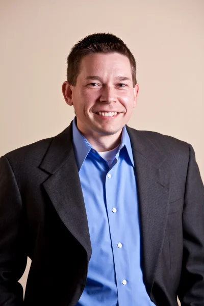 Man with a suit that is too large