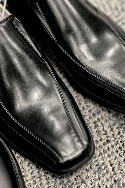 Low quality black dress shoes